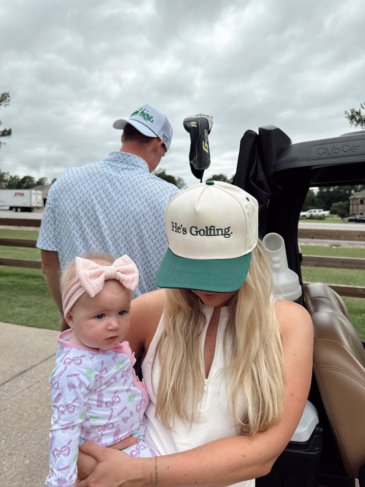 He's Golfing | Green Vintage Trucker Hat