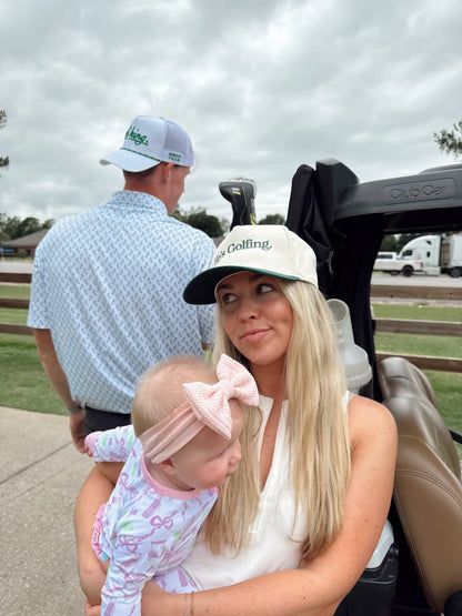 He's Golfing | Green Vintage Trucker Hat