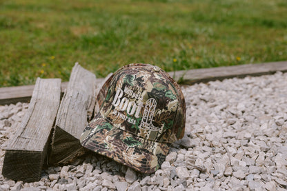 We'll Put A Boot in your Ass | Camo Trucker Hat